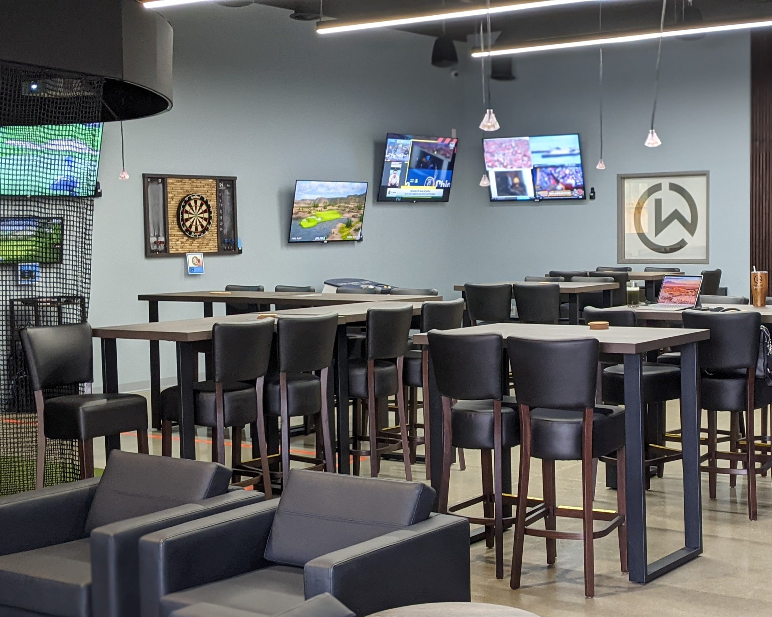 PXL_20241023_165018686.PORTRAIT~2 Close-up of a premium walnut wood workstation with a dual-monitor setup at Club Works.